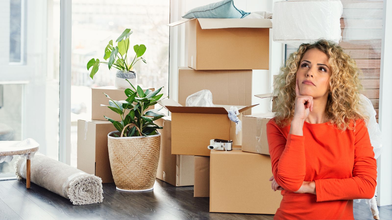 woman wondering should i hire a moving company